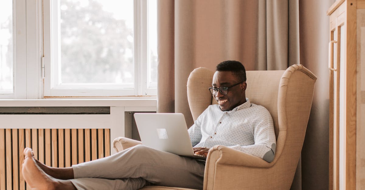 Man Relaxing and Working on his Laptop